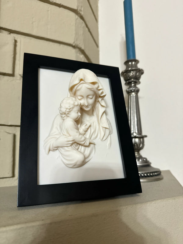 D relief portrait of St. Mary holding Jesus as a child